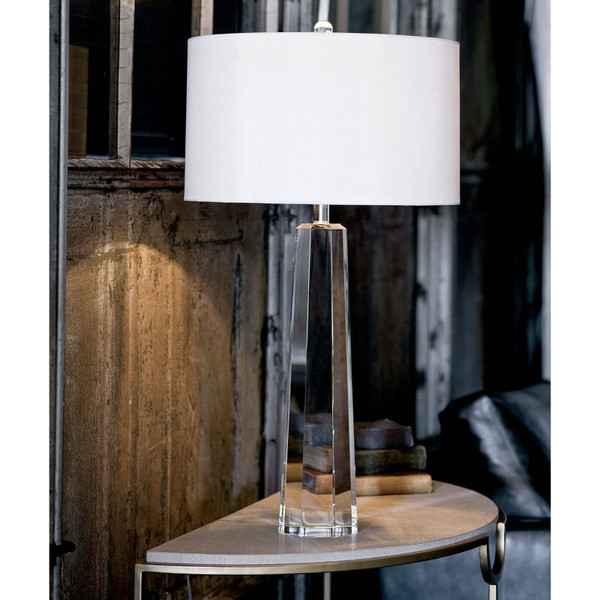 Shagreen console table with a crystal lamp on top of it